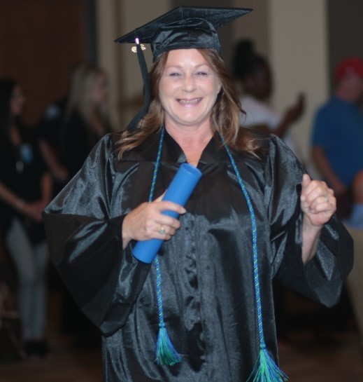 Lisa Biggers smiling with diploma