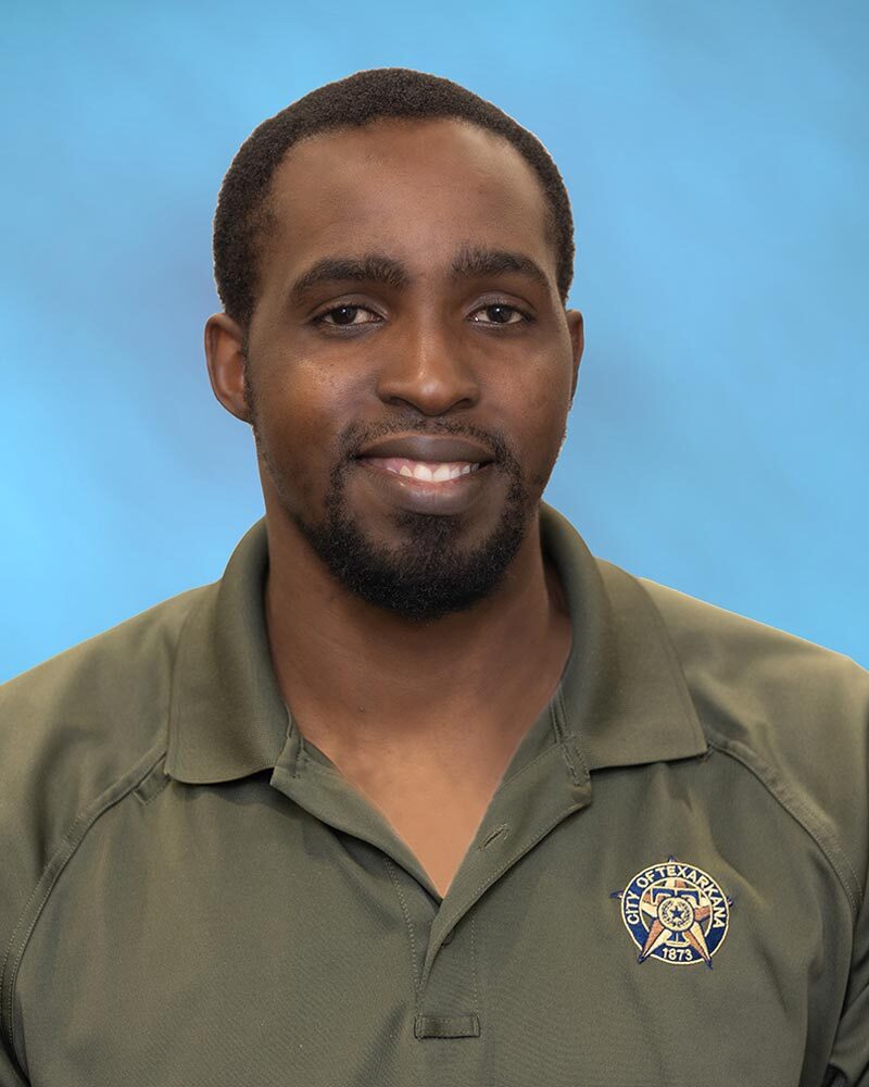 Vashil Fernandez is in his work uniform and smiling for his headshot.