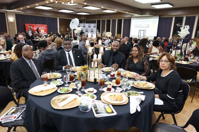 Group sitting at a table enjoying a meal. 