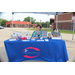 A woman sitting behind a table that reads &quot;First Choice Pregnancy Resource Center&quot;