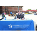 A man sitting behind a table that reads &quot;Texarkana College, A great place to start... or start over.&quot;