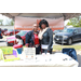 Two women standing behind a table with a sign that reads &quot;Rosehill Neighborhood Improvement Association&quot;