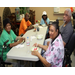 Smiling residents eating watermelon