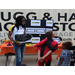 A man holding a box next to children