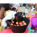 A young girl apple bobbing