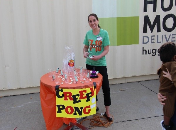 Woman posing at the Creepy Pong Station