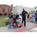 A group of children standing with a police officer