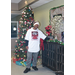 Man Standing next to Christmas Tree