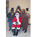 Two women posing with Santa