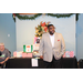 Antonio D. Williams in front of gifts