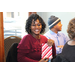 Woman smiling while holding a gift