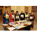 6 ladies showing book selection