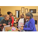 four ladies looking at coloring pages