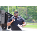 man with mic in ballcap speaking