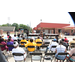 Crowd in folding chairs watching woman perform 