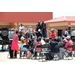 crowd in seats by stage watching band perform