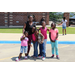 woman with 5 kids smiling for camera outside