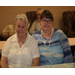 2 older women sitting together for picture