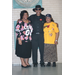 Man and 2 women standing posing for picture