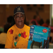 Woman posing with boxed wheelchair cushion for picture