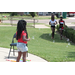 A girl blowing bubbles outside