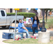 Two women outside by water bottles