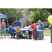 Children interacting with others at a table