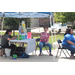 People sitting around a table under a canopy