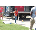 A boy throwing sand bags