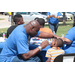 A man painting a boy's face