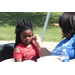 A woman painting a young girl's face