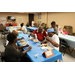 Group of people eating food at a table