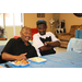 Two men smiling with food