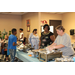 Two ladies serving food