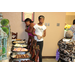 Two women standing in front of food