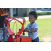 A boy touching a balloon tank