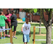 a kid standing outside looking at the camera