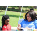 a woman getting ready to paint a little girls face