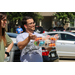 a man holding a basket of ice pops