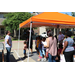 children standing under an orange canopy