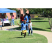 a boy and a girl running outside