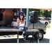 a woman reading off a pice of paper into a microphone