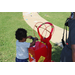 a little boy trying to pump a balloon with air