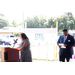 A woman speaking behind a podium