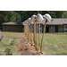 Shovels lined up with helmets on top