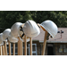 close up of helmets on shovels