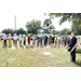 A crowd of people using shovels to dig