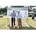 two men holding shovels