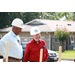 two men in hard hats smiling 