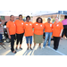 Organizers posing together in orange shirts